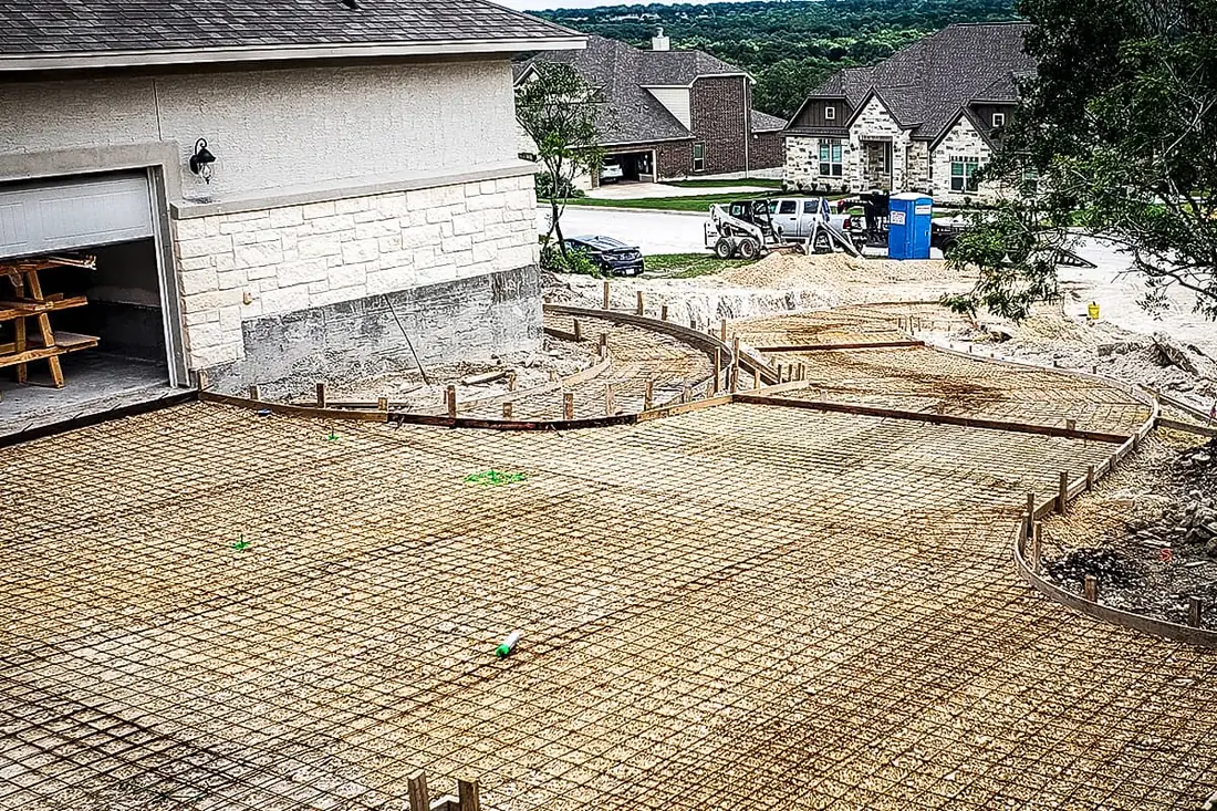 Timber forms and wire mesh set for a concrete driveway pour in San Antonio