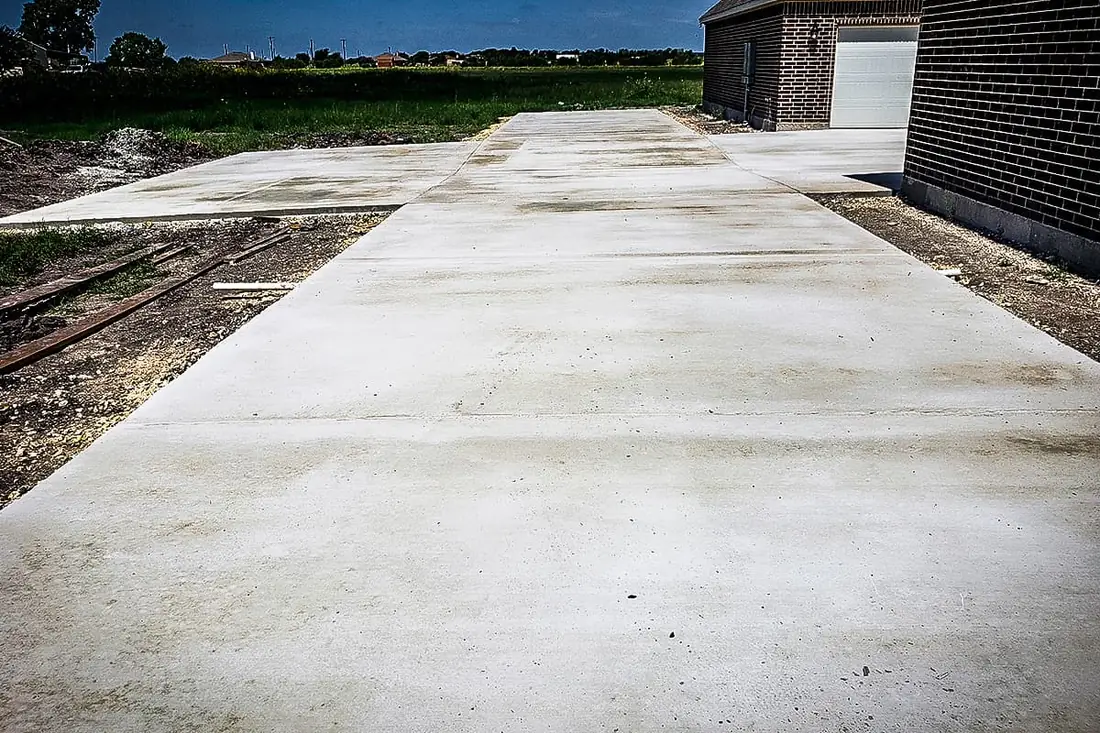 New concrete driveway at a recently built home outside San Antonio