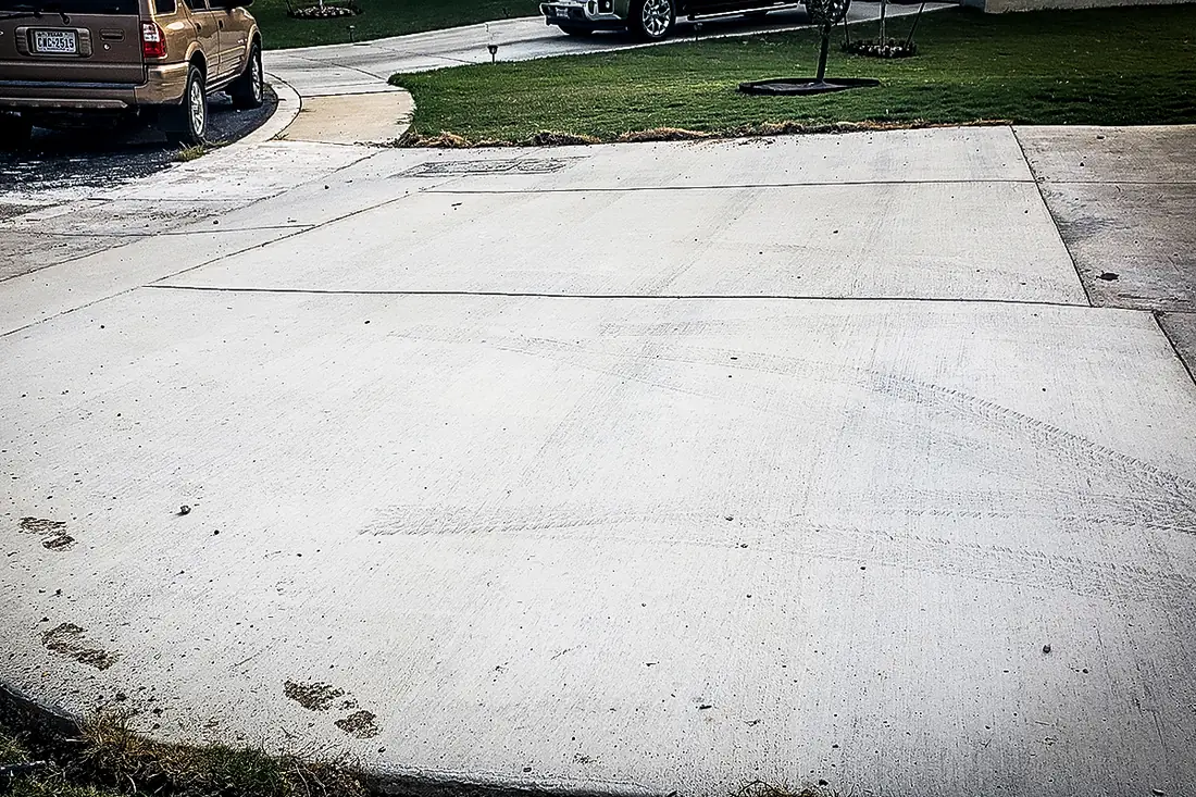 Replacement concrete driveway poured to the street in San Antonio