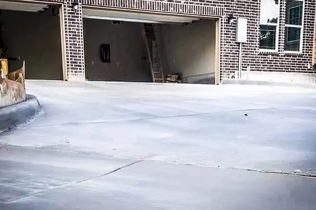 Wide concrete parking apron in front of a garage in San Antonio